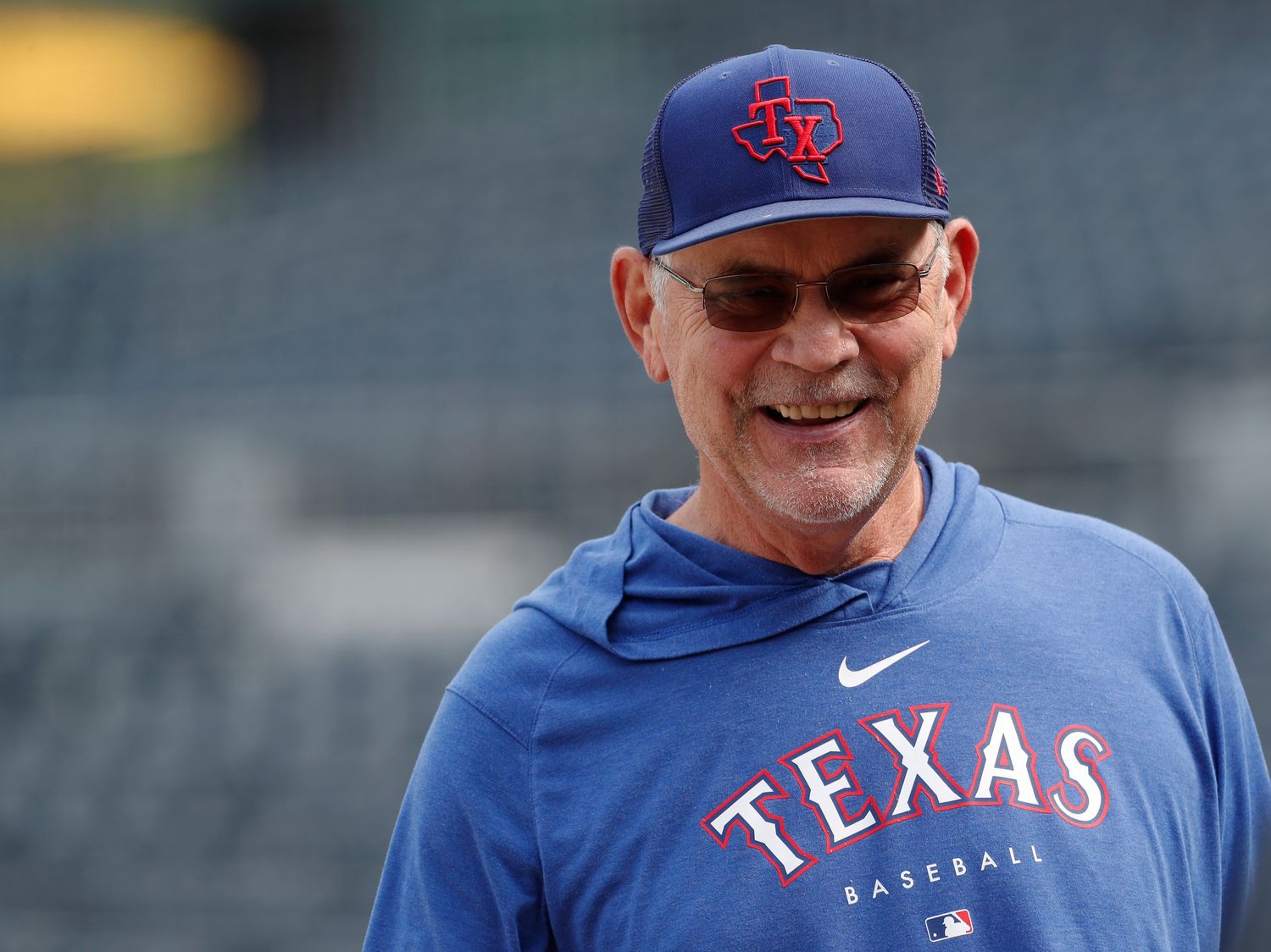 May 23, 2023; Pittsburgh, Pennsylvania, USA; Texas Rangers manager Bruce Bochy (15) smiles on the field before the game against the Pittsburgh Pirates at PNC Park. Mandatory Credit: Charles LeClaire-USA TODAY Sports